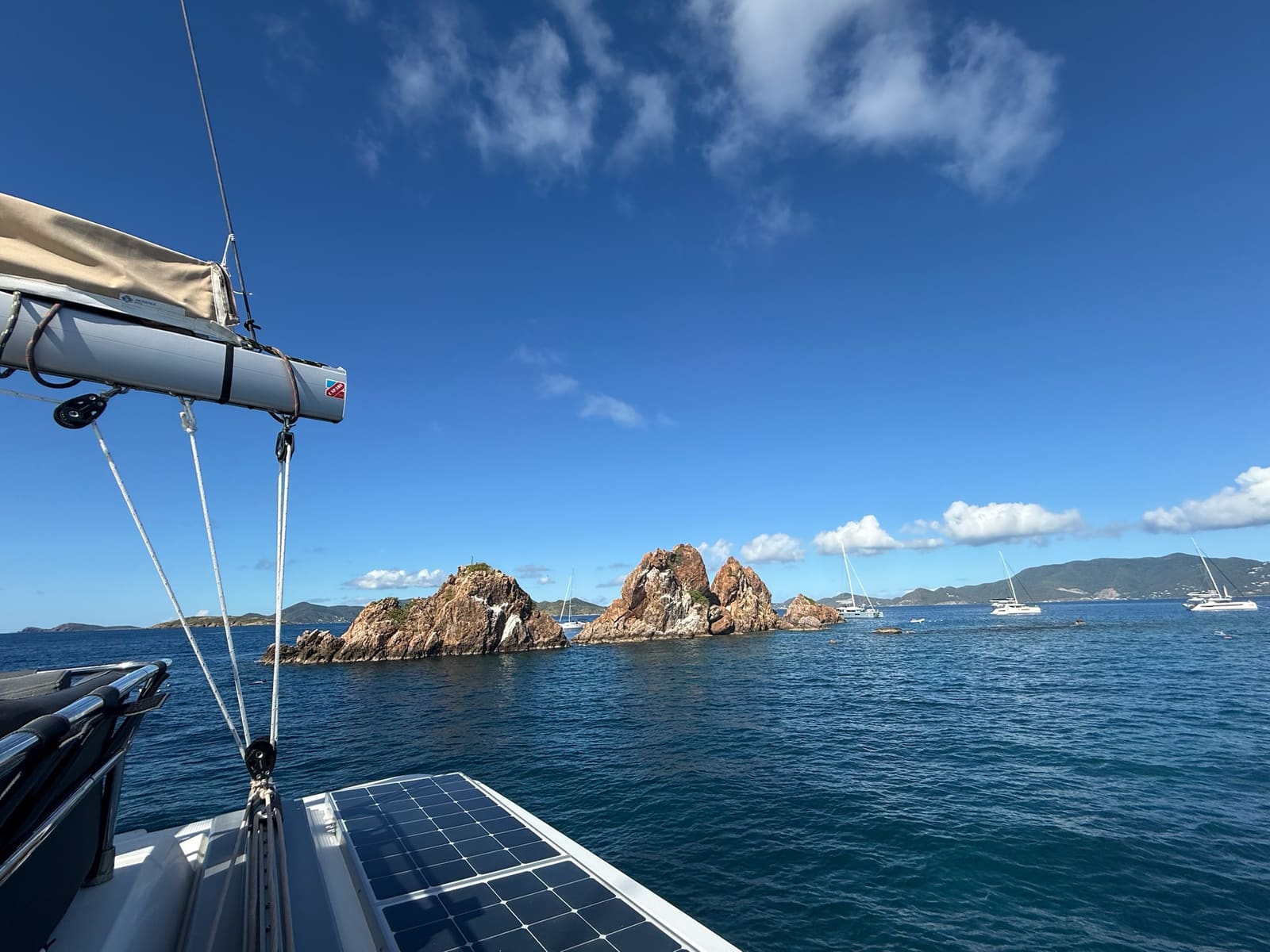 View from the side deck toward rock pinnacles rising from the sea