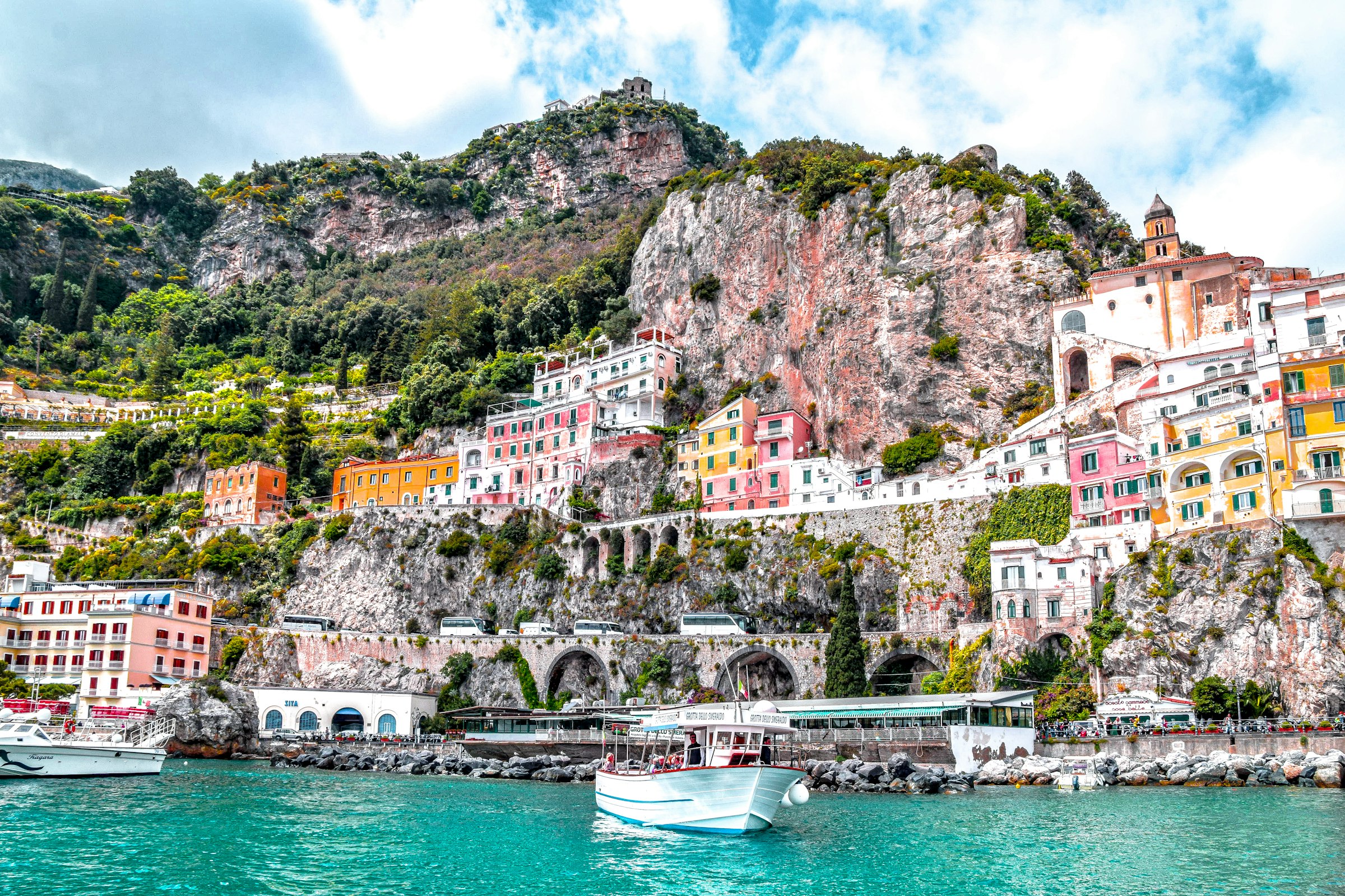 Pastel houses of an Amalfi coast village seen from the water